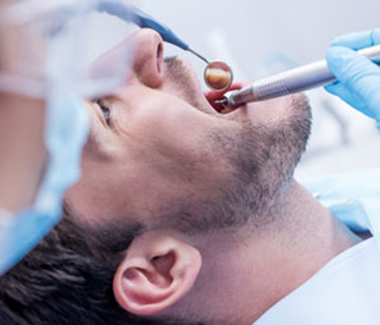 Dentist curing patients teeth