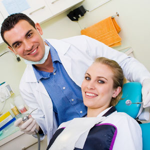 Happy dentist and patient in dentist's office