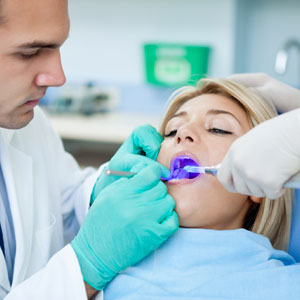 Dental drying procedure at dental office with modern equipment