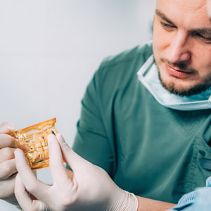 Dentist explaining dental implant procedure