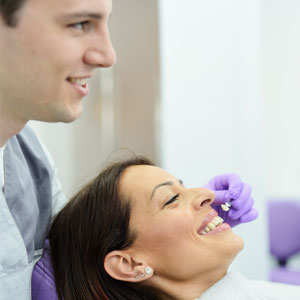 Patient choosing the color for her new veneers