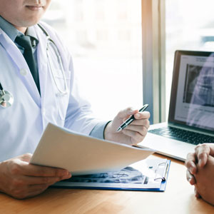 Dentist explaining the dental treatment to a patient in the office