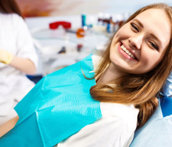 Woman at the dentist's chair during a dental procedure